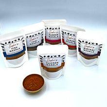 Load image into Gallery viewer, Image of the full range of Sashi's masalas. 6 packets of 50g masalas with Chicken in front.
