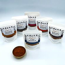 Load image into Gallery viewer, Image of the full range of Sashi's masalas. 6 packets of 50g masalas with Fish in front.